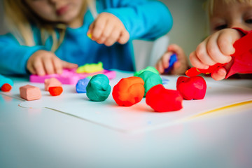 kids play with clay molding shapes, learning through play