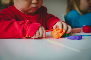 kids play with clay molding shapes, learning through play