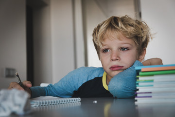 little boy tired stressed of reading, doing homework - 234287473