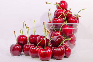 cherries in a bowl isolated on white