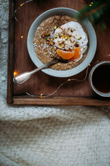 gluten-free oatmeal with berries and nuts and tender lactose-free vegetarian yogurt