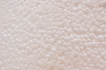 Obraz na płótnie Canvas White Styrofoam Texture. White styrofoam balls background. Close shot. Safe packaging for fragile items. Detailed background of white styrofoam material