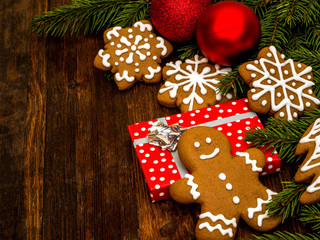 Happy New Year and Merry Christmas gingerbread on wood background. Christmas baking. Making gingerbread christmas cookies. Christmas concept.	