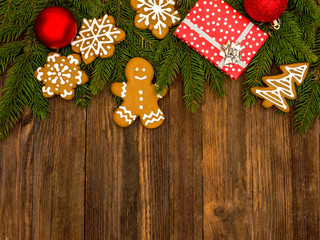 Happy New Year and Merry Christmas gingerbread on wood background. Christmas baking. Making gingerbread christmas cookies. Christmas concept.	