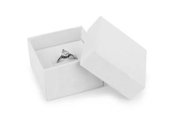 image of wedding rings in a gift box on white background