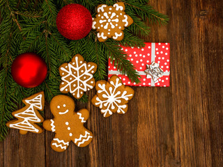 Happy New Year and Merry Christmas gingerbread on wood background. Christmas baking. Making gingerbread christmas cookies. Christmas concept.	
