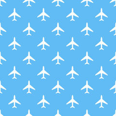Vector seamless pattern of white airplanes on blue background.