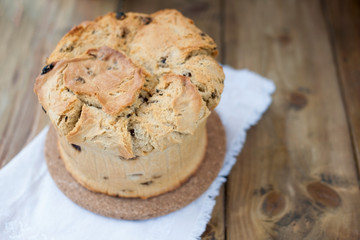 Easter cupcake on wooden background. Homemade baking. Free space for text.