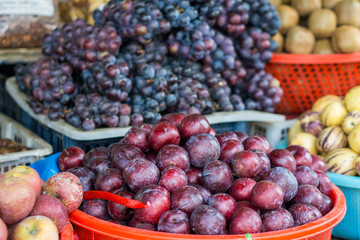 Different fruits on a local market of Sapa in the north of Vietnam