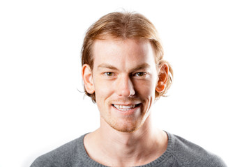 Male portrait of a fair-haired man of European appearance, on a white background. Emotions. Smile