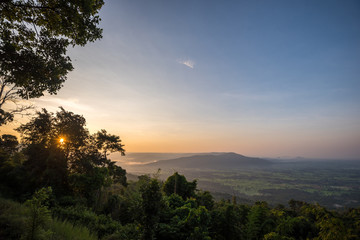 Fototapeta na wymiar scenery during sunrise time with mountain and savannah field