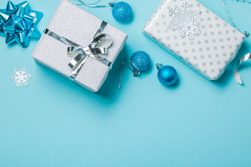 Christmas background - presents and decorations in silver and blue