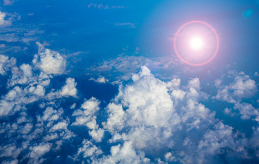 clouds and abstract sun from lens flare. aerial view