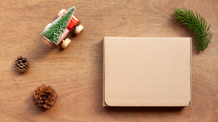 Gift box and Christmas decoration object on wooden table. oncept of christmas holiday celebration and new year. Top view