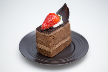 Slice of chocolate cake in saucer