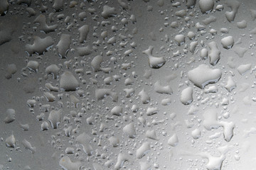 The dew on the car surface is grayish white.