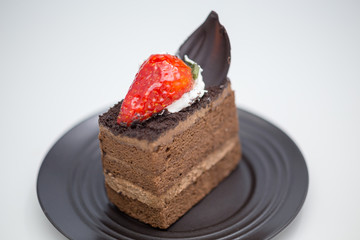 Slice of chocolate cake in saucer
