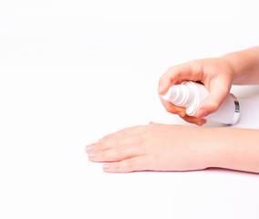 Children's hands and cream in a white tube. On white background. Baby skin care.