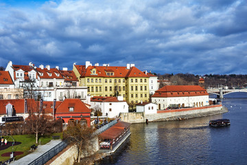 Obraz premium Prague, Czech Republic Beautiful view of the Dvorak embankment, the Vltava river and the old town of Prague. Panorama of the center of Prague, Czech Republic.