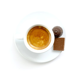 chocolate bonbons and espresso cup of coffee on white background