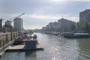 boats at pier of one of Rotterdam canals
