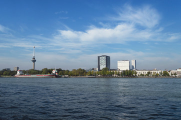 Obraz premium view on euromast and cityscape of Rotterdam from river bank