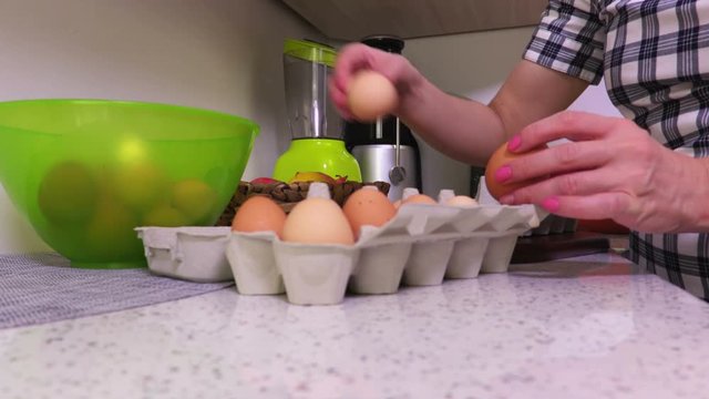 Woman is graded by brown chicken eggs