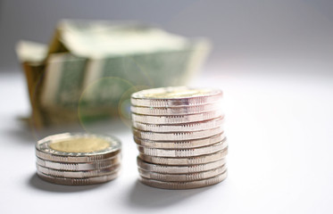 Close up coins for banking, economics, loan, finance, money. Pile of coins and us dollars. Change and bills. Money saving concept. Economy grow. Expensive life and poor people. Salary day. Copy space