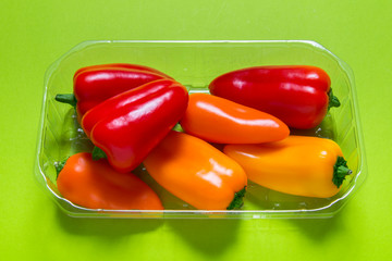 Group of  mini paprica, red, yellow and orange in plastic package