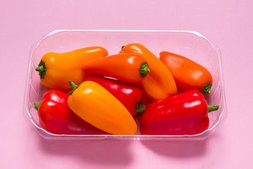 Group of  mini paprica, red, yellow and orange in plastic package