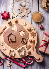 Christmas cookies, baking gingerbread cookies, raw dough and cutters
