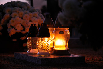 the candles burning in the cemetery