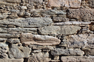 Old handmade stone wall masonry detail texture horizontal