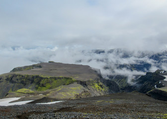 Epic landscape around plateau of Morinsheidi with mountains and glaciers in the clouds, between the Eyjafjallajokull and Myrdalsjokull in southern Iceland
