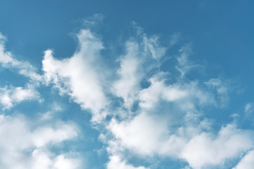 beautiful white clouds on a bright blue sky on a warm summer day