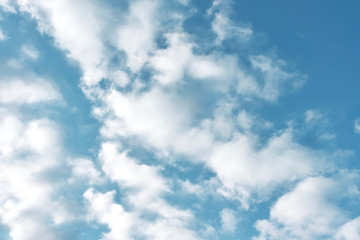 beautiful white clouds on a bright blue sky on a warm summer day
