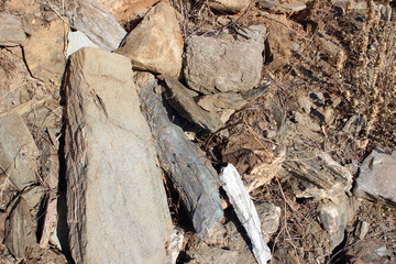 Rubble debris from abandoned stone house evia island greece rocks and dry vegetation