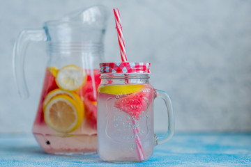 Lemonade watermelon and lemon in a glass carafe. The concept of a refreshing drink in the summer.