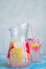 Lemonade watermelon and lemon in a glass carafe. The concept of a refreshing drink in the summer.