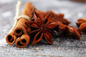 cinnamon and staranise winter spices on rustic background