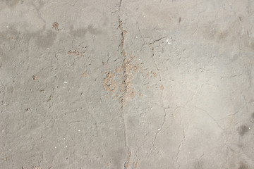 Concrete plaster cement wall with stains markings cracks detail close up
