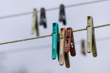 clothespins on a rope, water drops