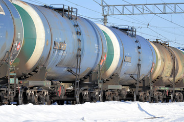 Train. Cars for transportation of fuel. Winter is a sunny day. Russia