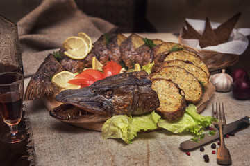 Stuffed pike with vegetables and greens. Russian food