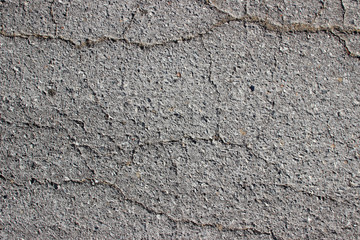 Obraz na płótnie Canvas Old asphalt surface texture detail with cracks fractures lines close up