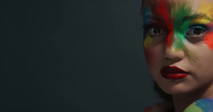 close up portrait beautiful woman wearing colorful face paint exotic multicolored body art sensual female enjoying creative expression
