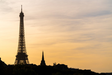 Fototapeta na wymiar Silhouette Sunset view of Eiffel tower in Paris, France. Summer Paris. Architecture and landmarks of Paris. Postcard of Paris