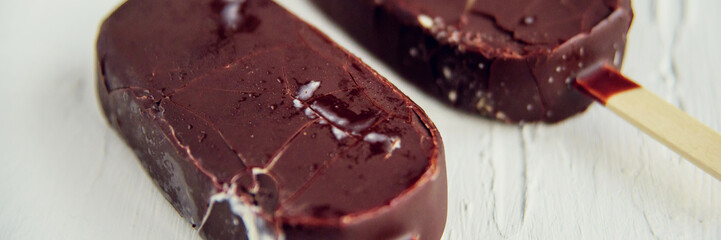 Ice cream coated with chocolate glaze, top view