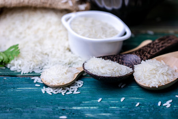 raw Thai jasmine rice on wood table top