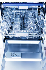 Home appliance dishwashing machine in kitchen interior, no people